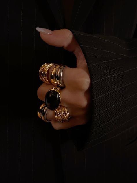 Gold ring stack — maximalist jewellery styling with intention