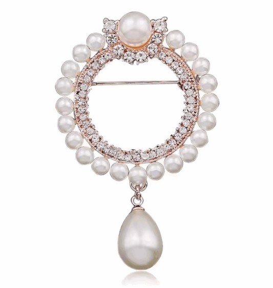 Broche prateado com pérolas e cristais, formato redondo com gota pendente – Kaya and Olivia

