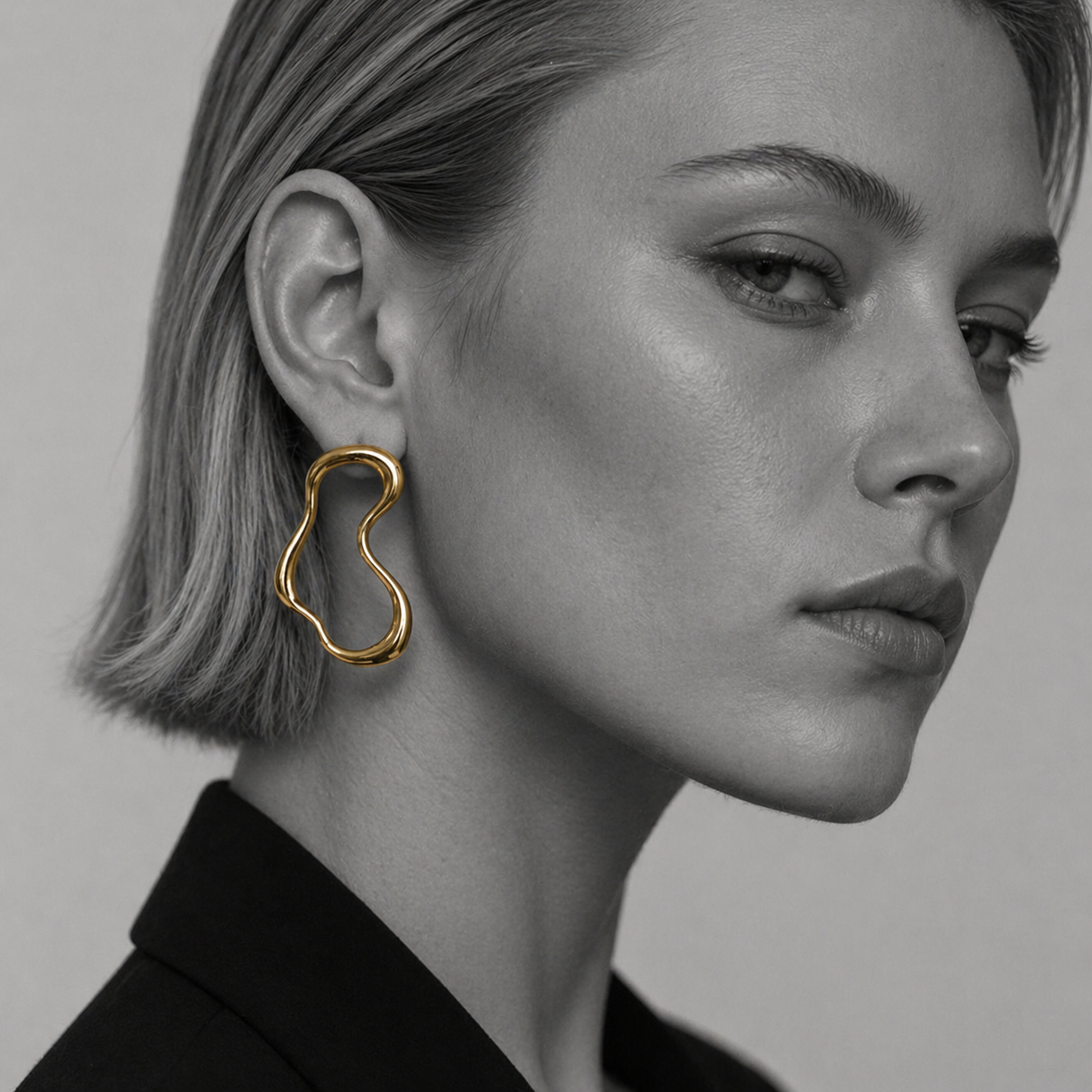 Unda earrings by Kaya & Olivia — worn on model, gold wave earrings, contemporary