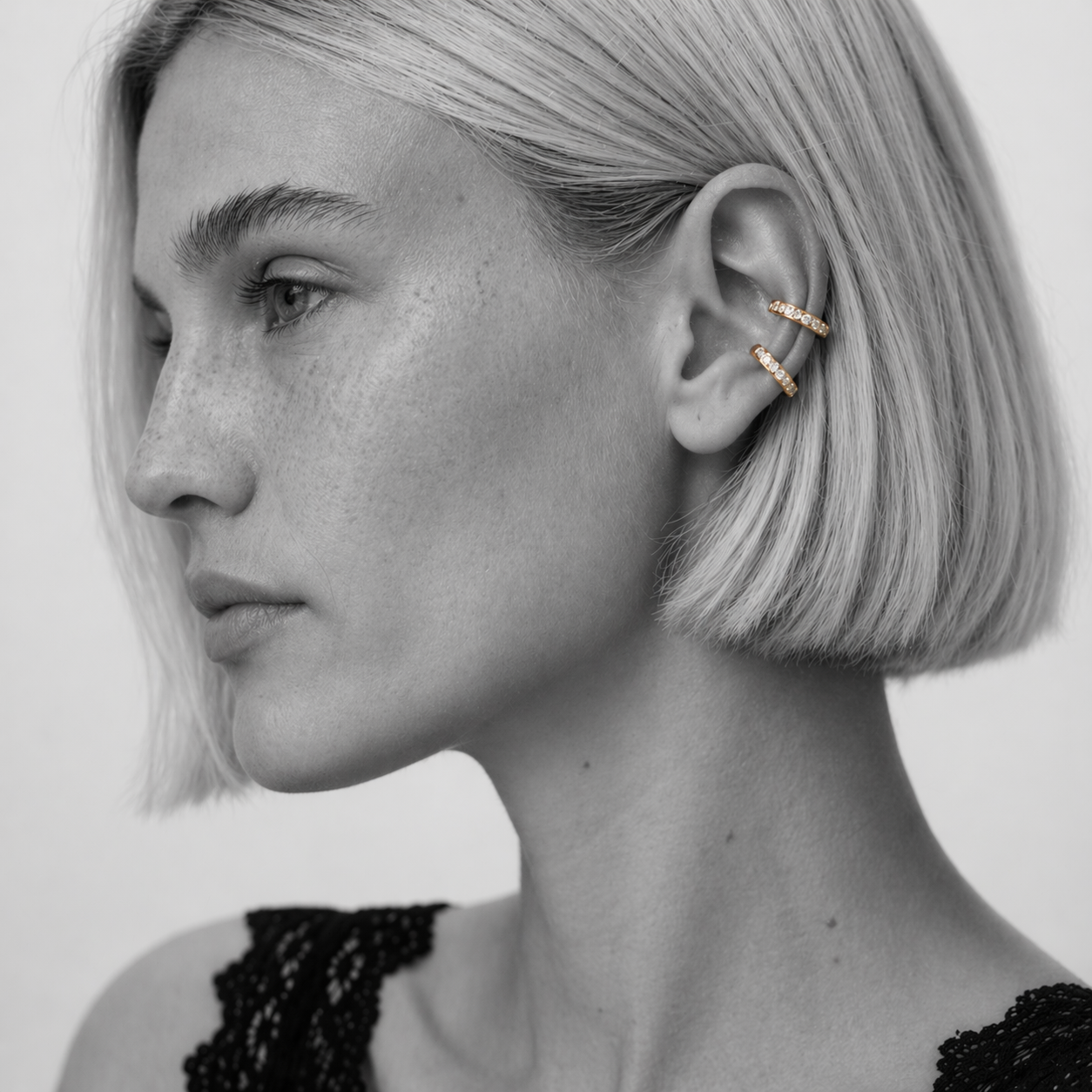 Thessa earcuff by Kaya & Olivia — worn on model, open-hoop sculptural earcuff